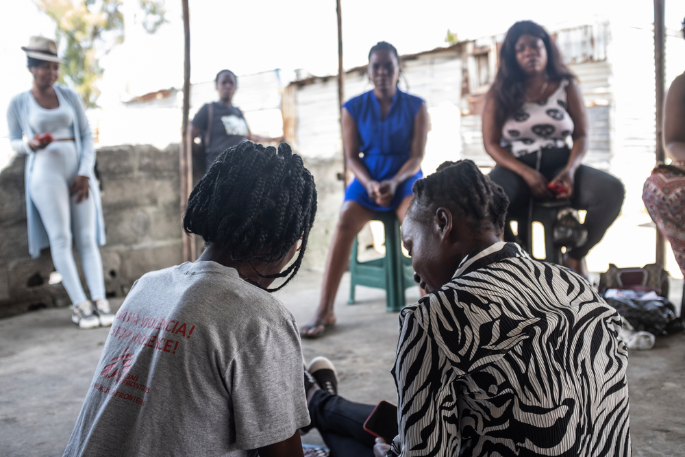 A member of MSF's Community Outreach team, at left, speaks with a patient of MSF's mobile clinic in an under-resourced neighborhood in Beira, Mozambique about safe abortion care. The mobile clinic offers sexual and reproductive services, including safe abortion care and HIV testing and treatment to under-resourced communities in Mozambique