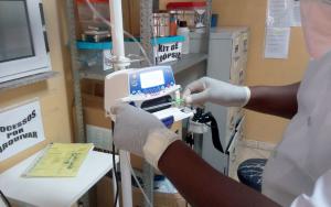 Image of MSF staff checking medical equipment