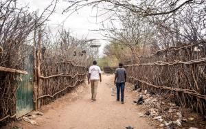 MSF Staff walking through one of the streets in Dagahaley camp, Dadaab