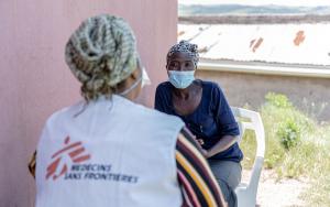 MSF fieldworker speaking with a DR-TB patient