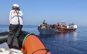 MSF teams operate the first rescue of the day from a boat in distress with xx people on board.