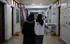MSF midwife supervisor, Taqwa Abdulghani, Hassan assisting a mother Aiesha* to walk after she went through caesarean section for birth of her daughter at Al-Jamhouri hospital in Taiz City, Yemen.