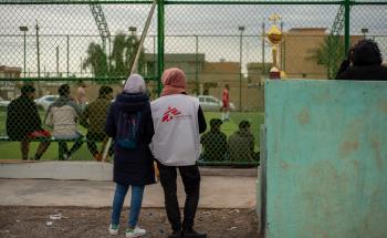 Medical Care in Iraq: MSF Worker watching soccer in Hawija