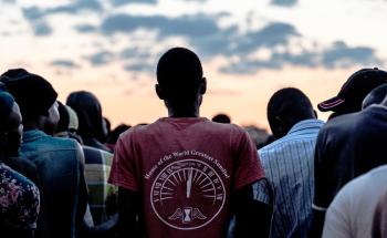 Men standing in line to receive blankets which were being distributed by a local group to men staying at a men's shelter for refugees in Musina, South Africa. 