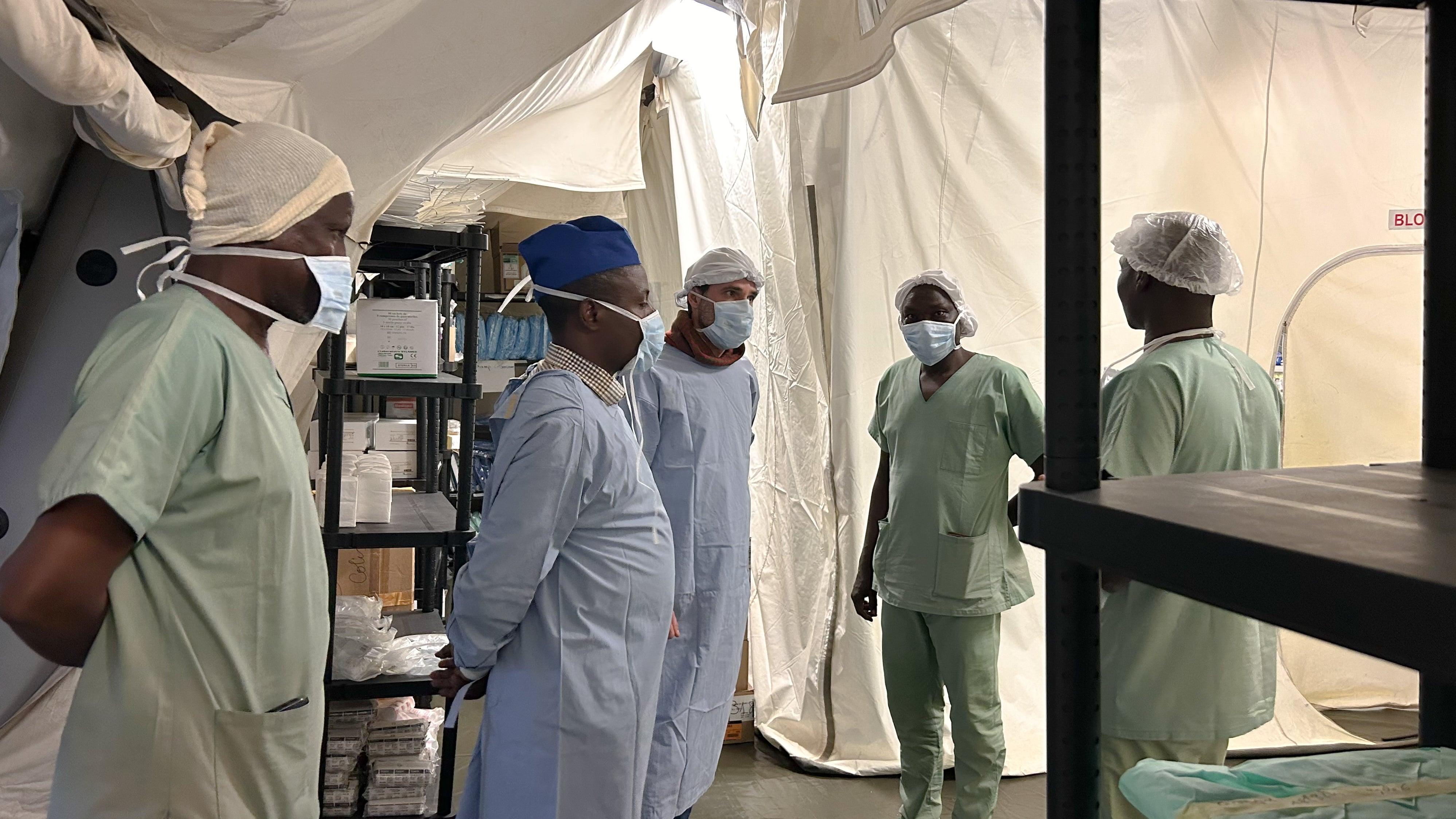 Adre, Chad: Mariam and Dr Zibert: MSF international president Dr Christos Christou visiting the MSF inflatable hospital in Adré, Eastern Chad.