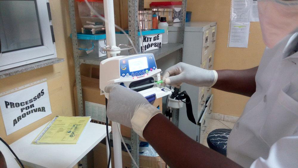 Image of MSF staff checking medical equipment