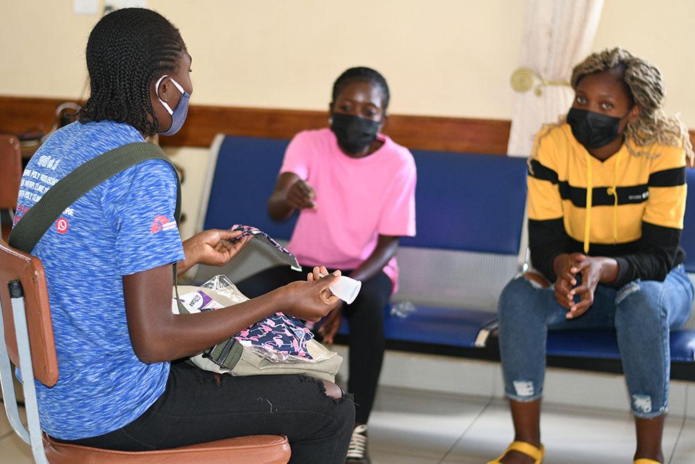 Peer educator in Zimbabwe having a group discussion with young women