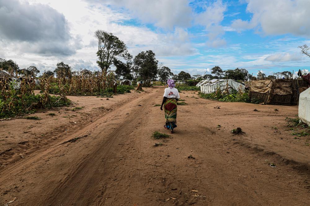 Atija walks through Eduardo Mondlane camp for displaced people