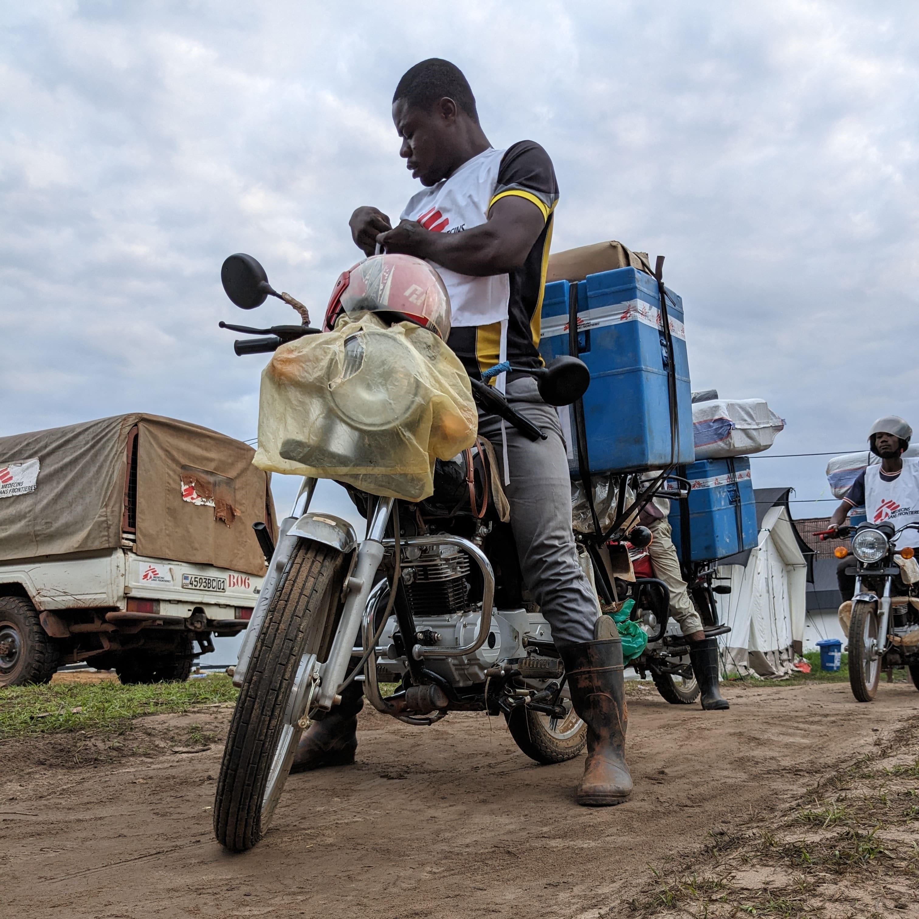 MSF Emergency Response DRC Measles: Refrigerated boxes keep vaccines cool for the measles vaccination campaign in the Ingende health zone, Equateur province.  As in many other areas of this province, a major challenge is to reach all the health areas, because of the impassability of the roads. To meet this challenge, MSF has made motorbikes and motorised pirogues available to reach the most remote communities.