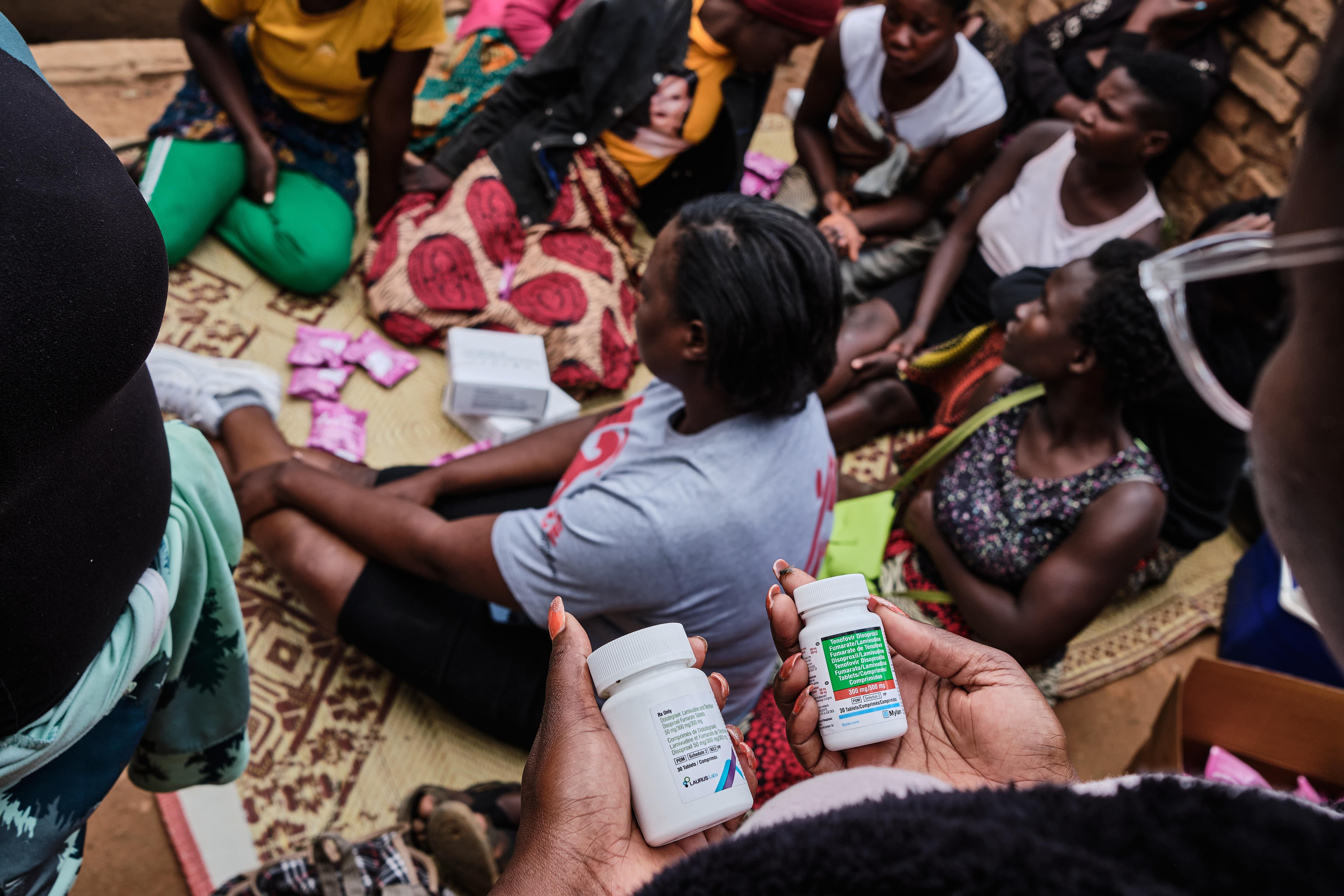 Sex Workers in Malawi: Jacqueline Zulu, MSF's health promotion officer, holds PREP and PEP medication before giving it to sex workers. MSF provides anti-HIV drugs to sex workers to prevent sexually transmitted diseases. Sex workers have an HIV prevalence of 60% in Malawi and are the key population most affected by the disease.