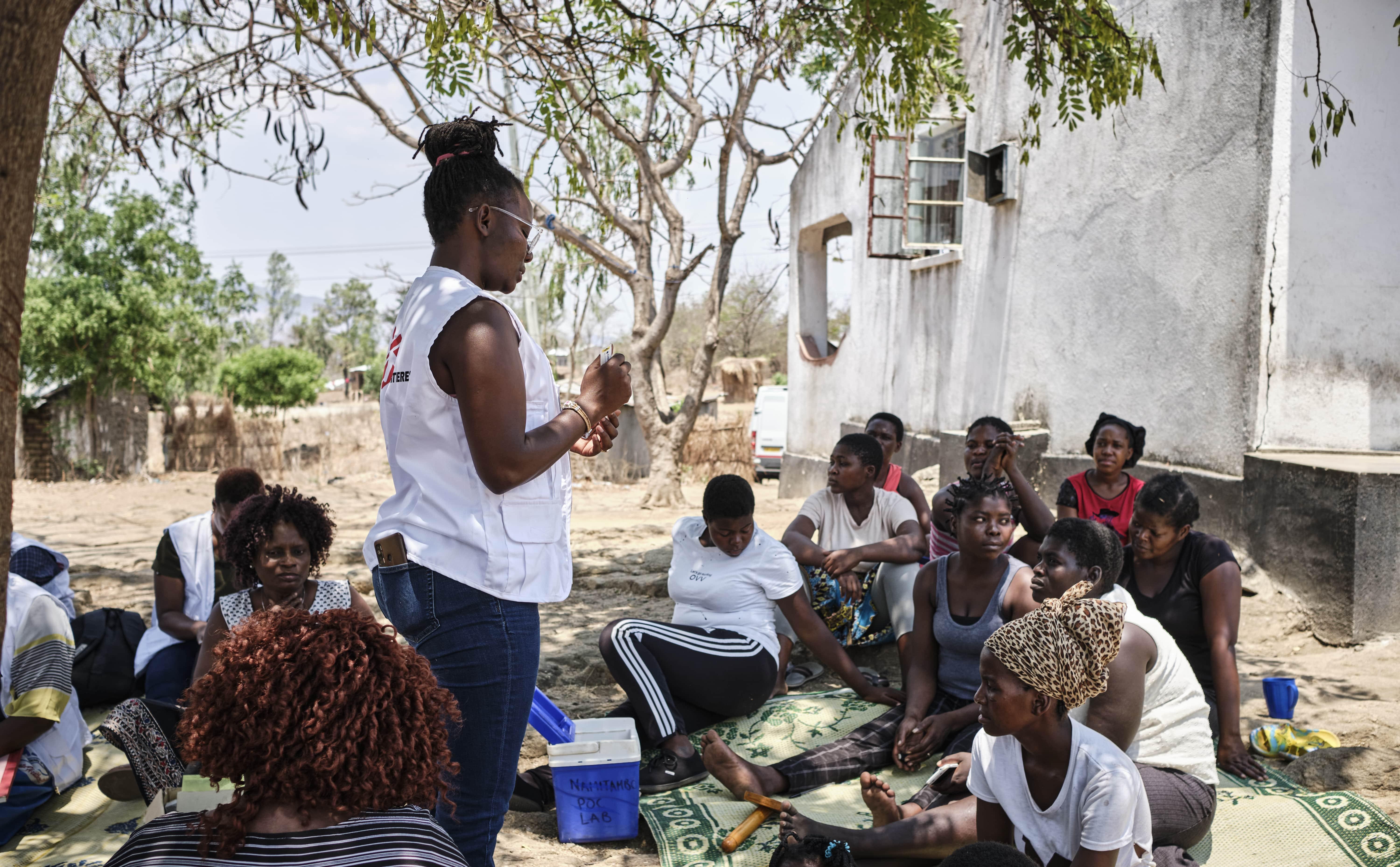 Sex Workers in Malawi: Jacqueline Zulu, MSF's health promotion officer, teaches sex workers how to perform a human papillomavirus self-test. Malawi has the highest rate of cervical cancer in the world, accounting 37 per cent of new cancer cases among women in the country. Nearly all cases of cervical cancer can be attributed to HPV infection.