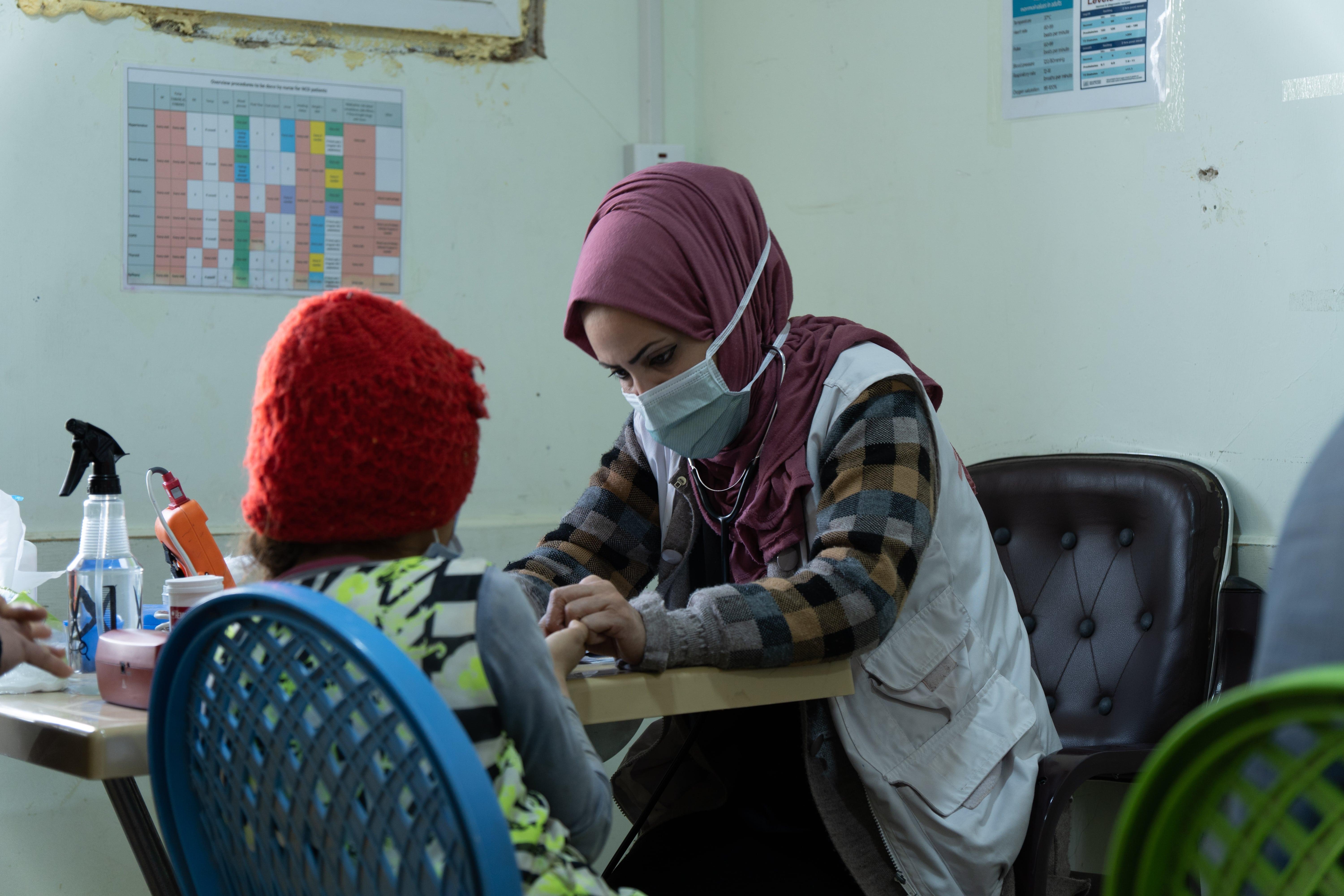 Medical Care in Iraq: MSF nurse checking the vital signs and glucose level of a diabetes patient at the MSF-run clinic.