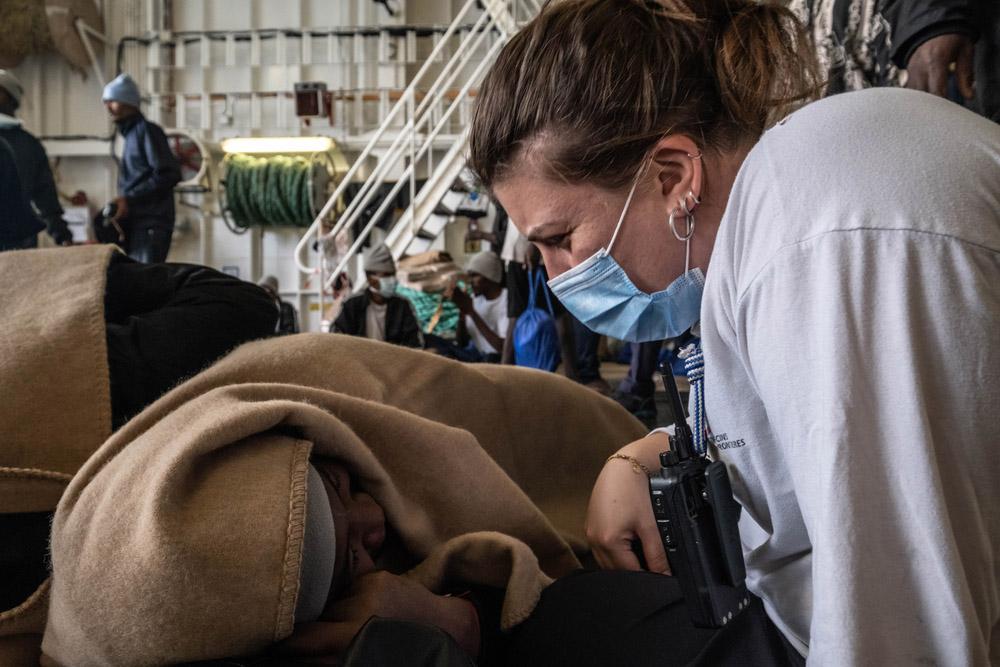 MSF Medical team leader Gianna talks with a survivor