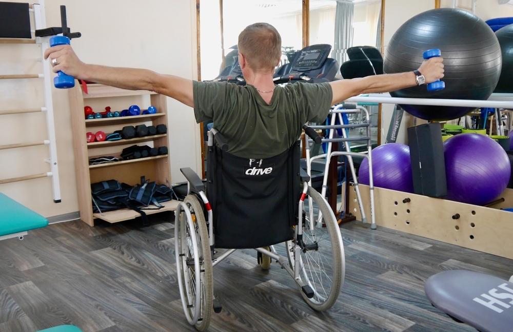 Image showing a Ukraine war wounded patient doing physiotherapy exercises, Ukraine-Russia war. This helps patients with mental health. 