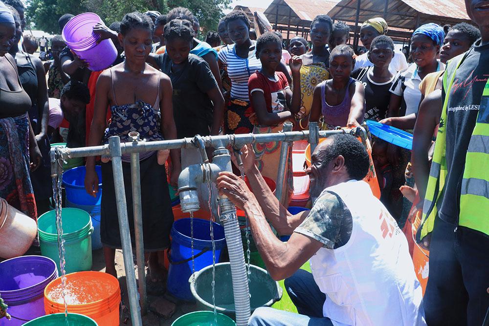 MSF staff member Phillip Msisya is seen fixing a pump at a water pumping station at Bangula camp for displaced people, where MSF is providing WASH facilities to people displaced by Tropical Cyclone Ana. 