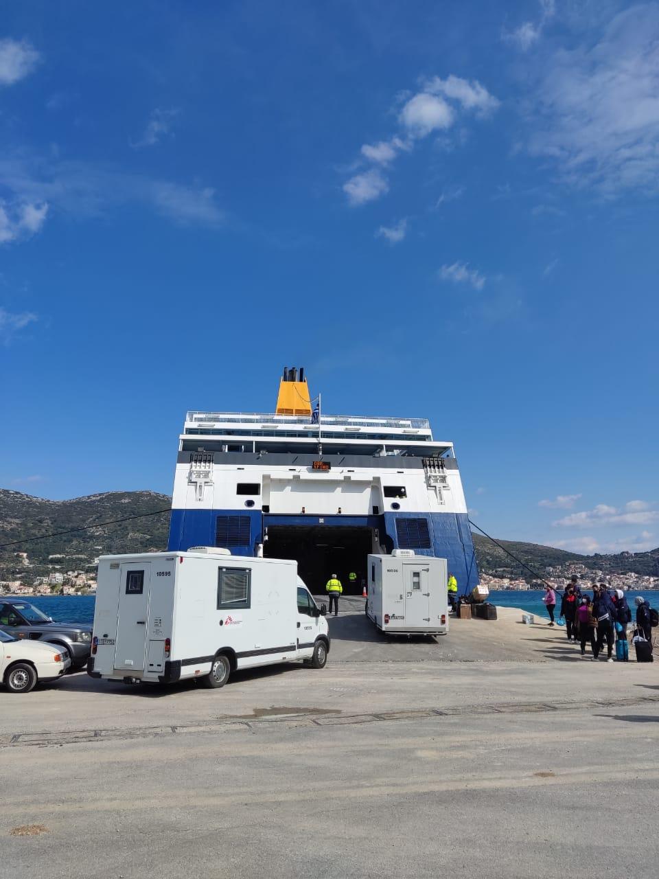 Loading of two mobile clinics on a boat in Samos, Greece, to be sent to the Polish-Ukrainian border. 