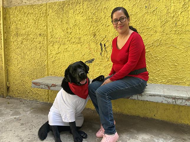 Onnie, the labrador and Alicia sitting together