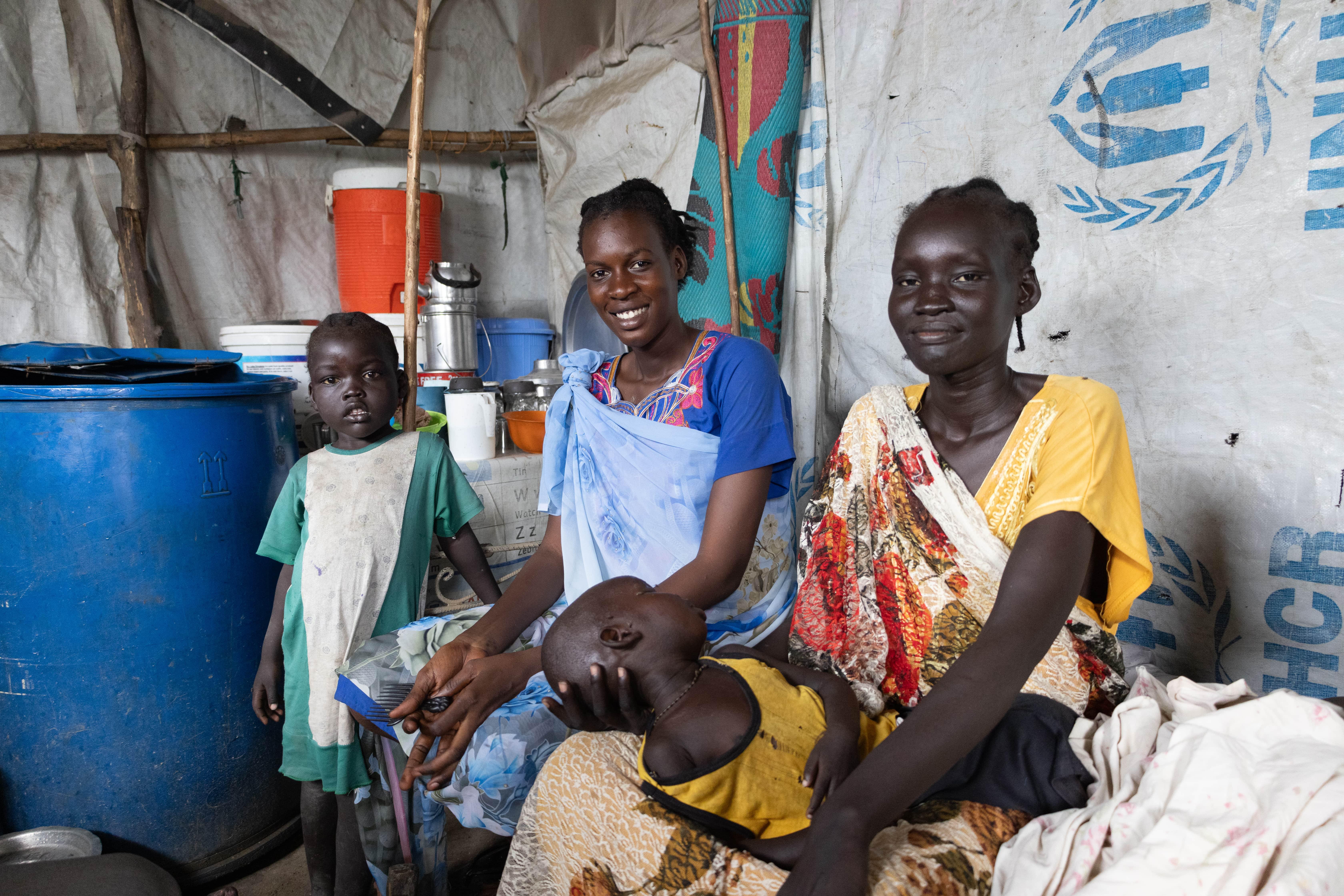 Sudan War & South Sudan Refugees: Nyachangjwok William Oguen arrived at the Protection of Civilians (PoC) site last April with her brother. Her child Zacharia Peter Dak (yellow shirt), four years old, is suffering from severe malnutrition.