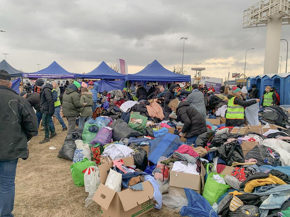 View of clothes and food donating point at the Polish border town of Medyka where Ukrainians have been arriving, fleeing their homes in the wake of the conflict. Monday, Feb. 28, 2022. The head of the United Nations refugee agency says more than a half a million people had fled Ukraine since the conflict started. 