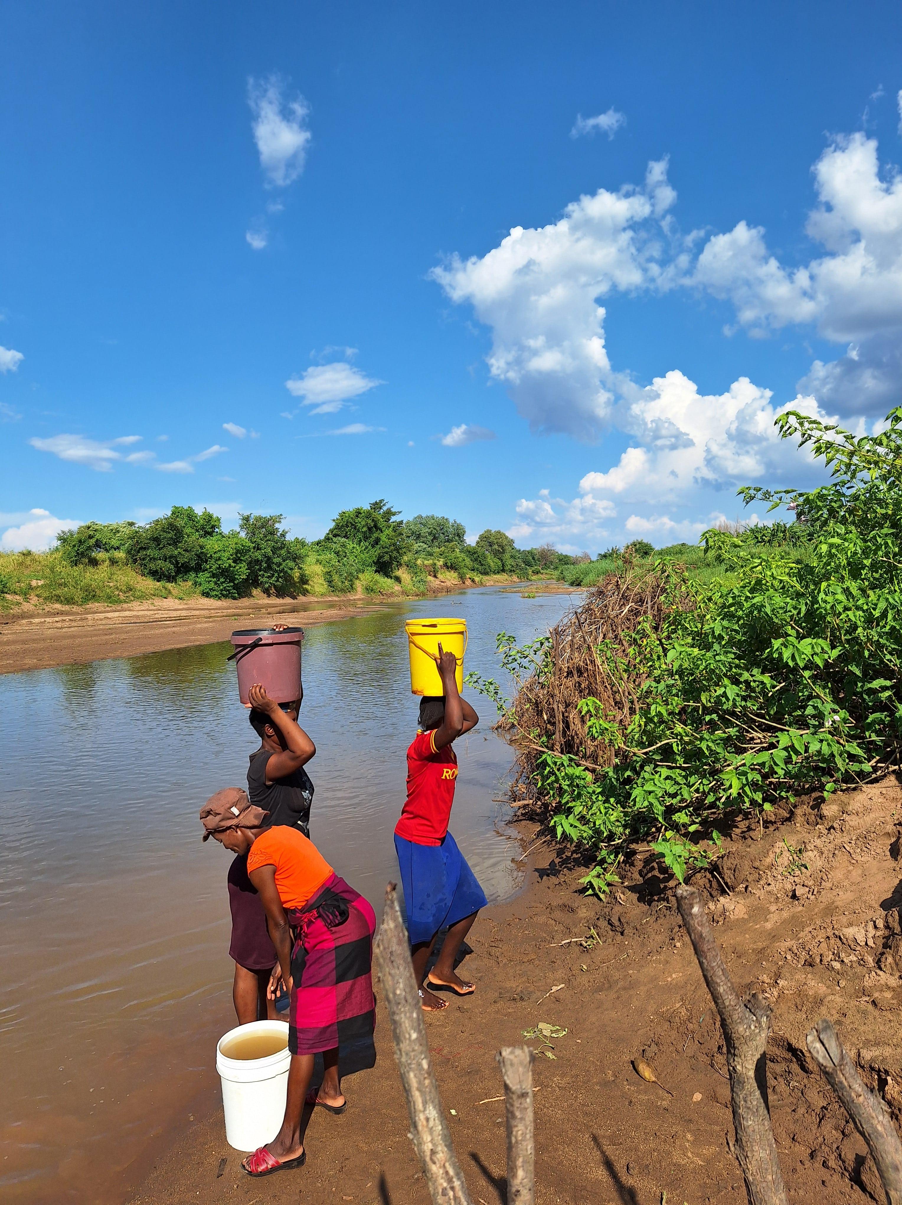 Villagers fetching water for drinking in the river in Mbire, Zimbabwe. Contaminated water can cause cholera. 